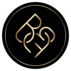 An image of the golden Body Beauty Fit By Amber logo placed within a circle on a black background.